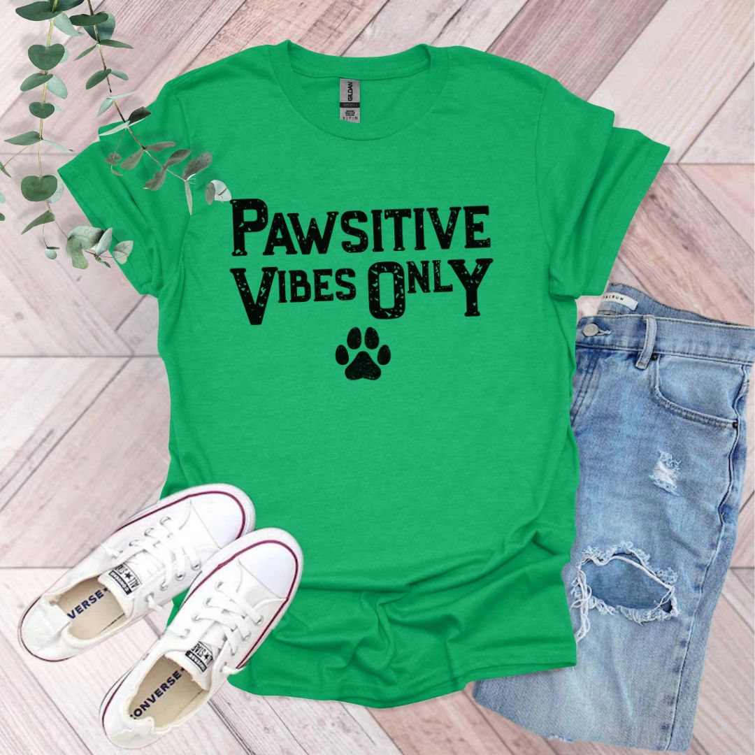 a green shirt that says pawstive vibes only with a paw print on it