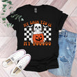 a black shirt with a pumpkin and a jack - o'- lantern on it