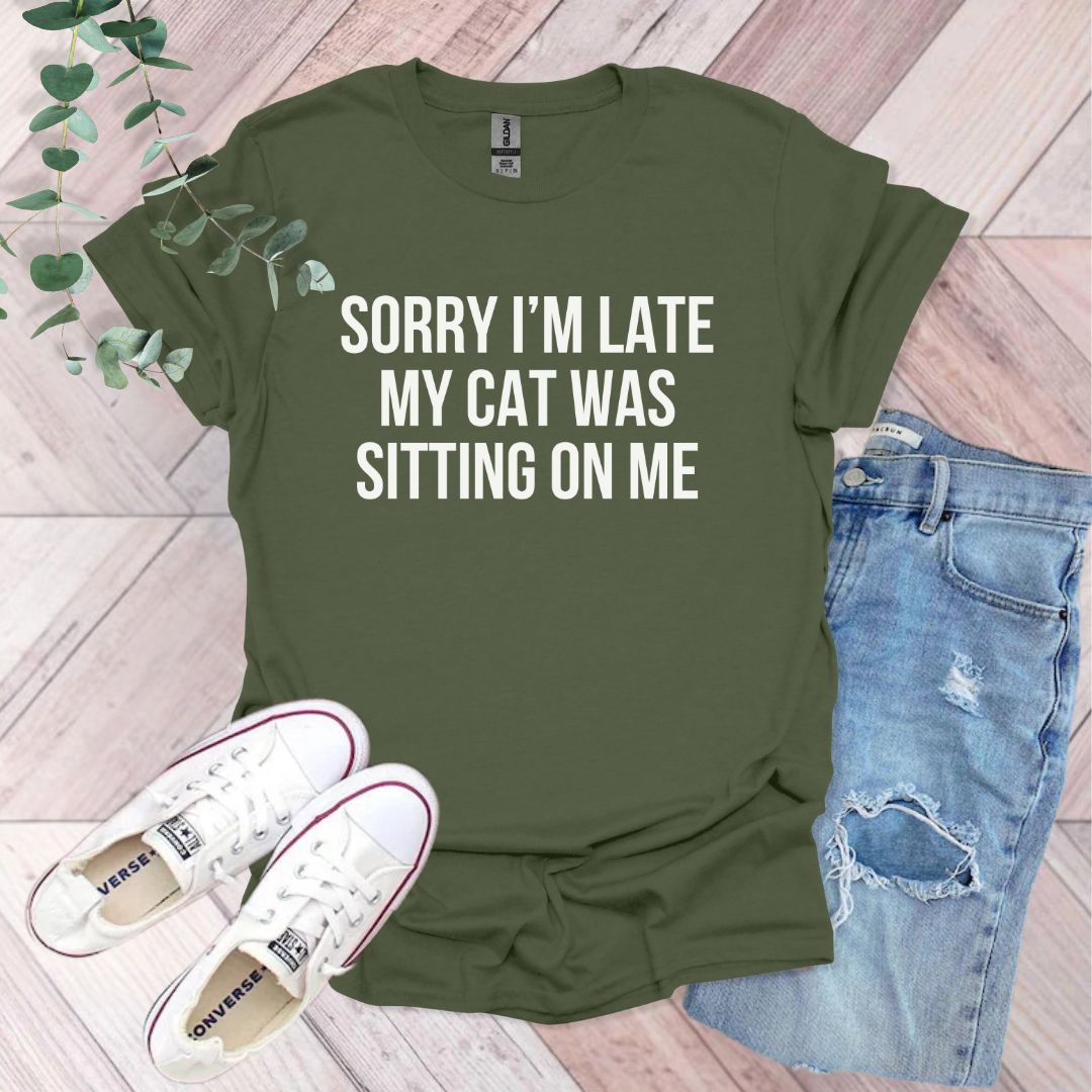 a t - shirt that says sorry i'm late my cat was sitting on