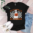 a black t - shirt with a dog wearing a jack o lantern pumpkin