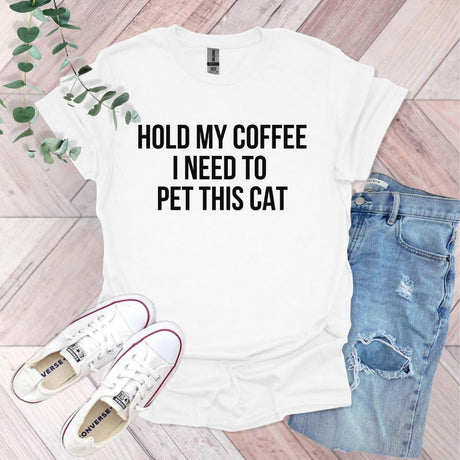 a t - shirt that says hold my coffee i need to pet this cat