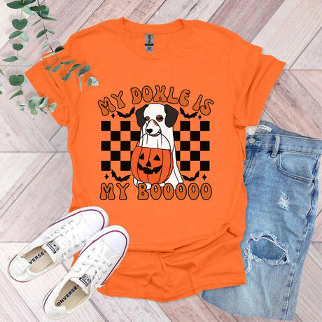 an orange shirt with a black and white dog on it