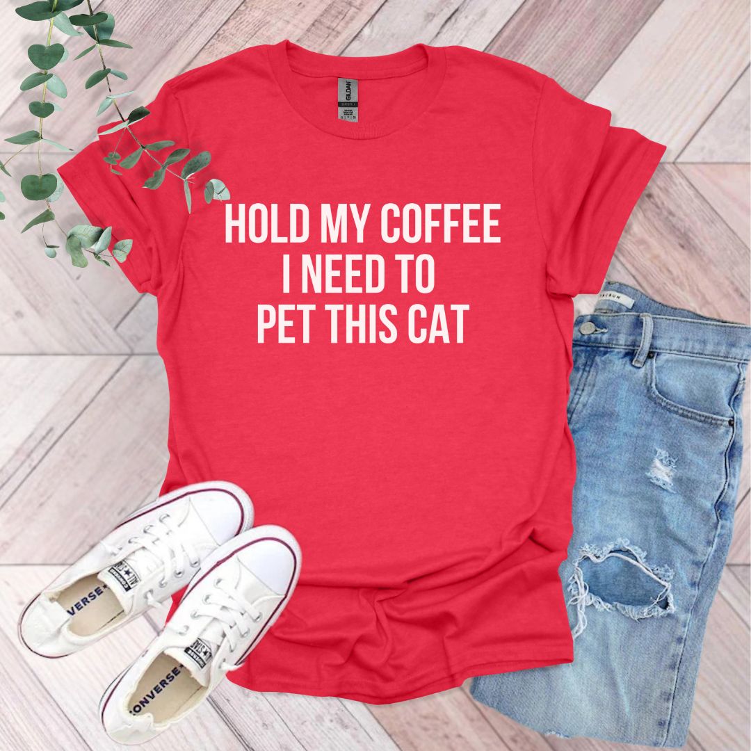 a red shirt that says hold my coffee i need to pet this cat