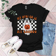 a black shirt with a ghost on it