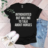 a t - shirt that says,'it's hard to talk about horses