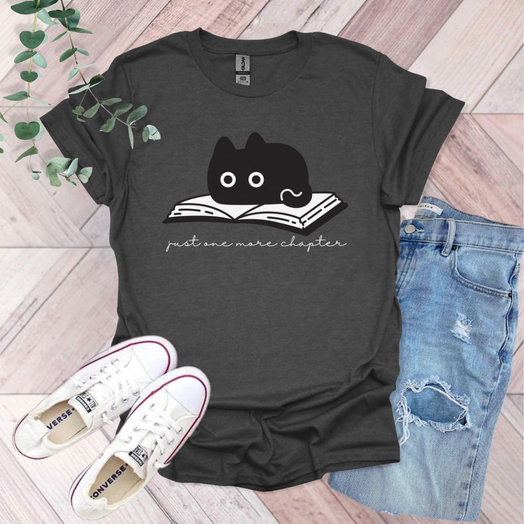 a t - shirt with a black cat reading a book