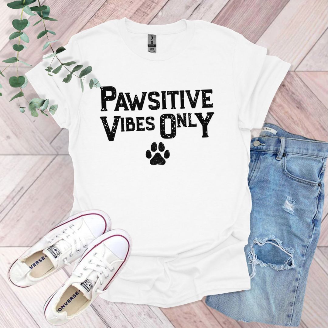 a t - shirt that says pawstive vibes only with a paw print on