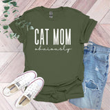 a t - shirt that says cat mom university next to a pair of jeans