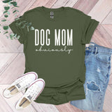 a t - shirt that says dog mom university next to a pair of jeans