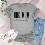 a gray shirt that says dog mom university next to a pair of jeans