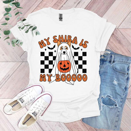 a white t - shirt with an orange pumpkin on it