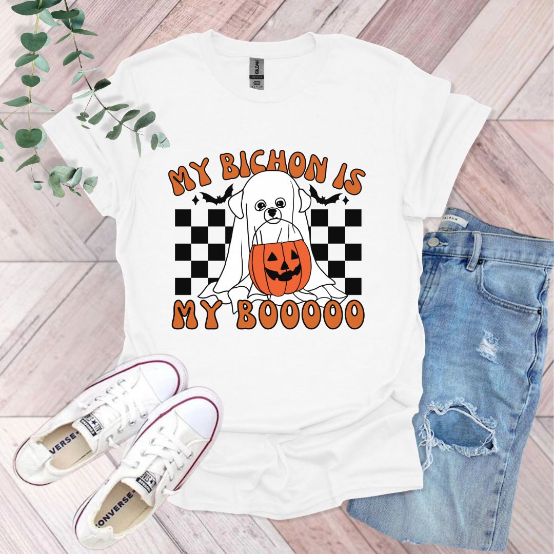 a white dog with a jack - o - lantern on it's chest and