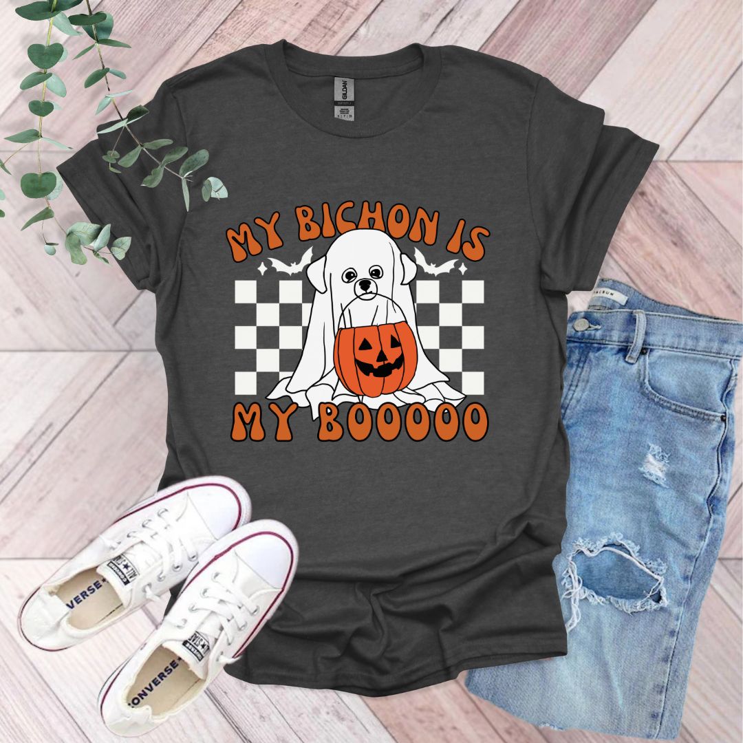 a black shirt with a white dog wearing a jack - o'- lantern pumpkin