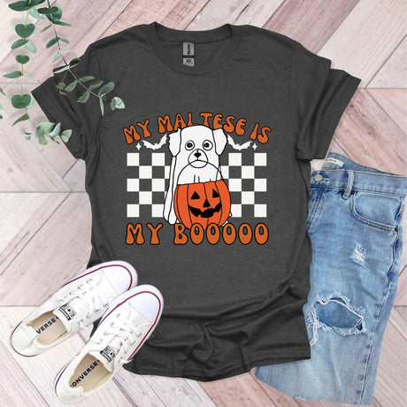 a black shirt with a dog wearing a jack o lantern on it