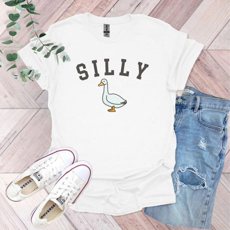 a white shirt with a duck on it