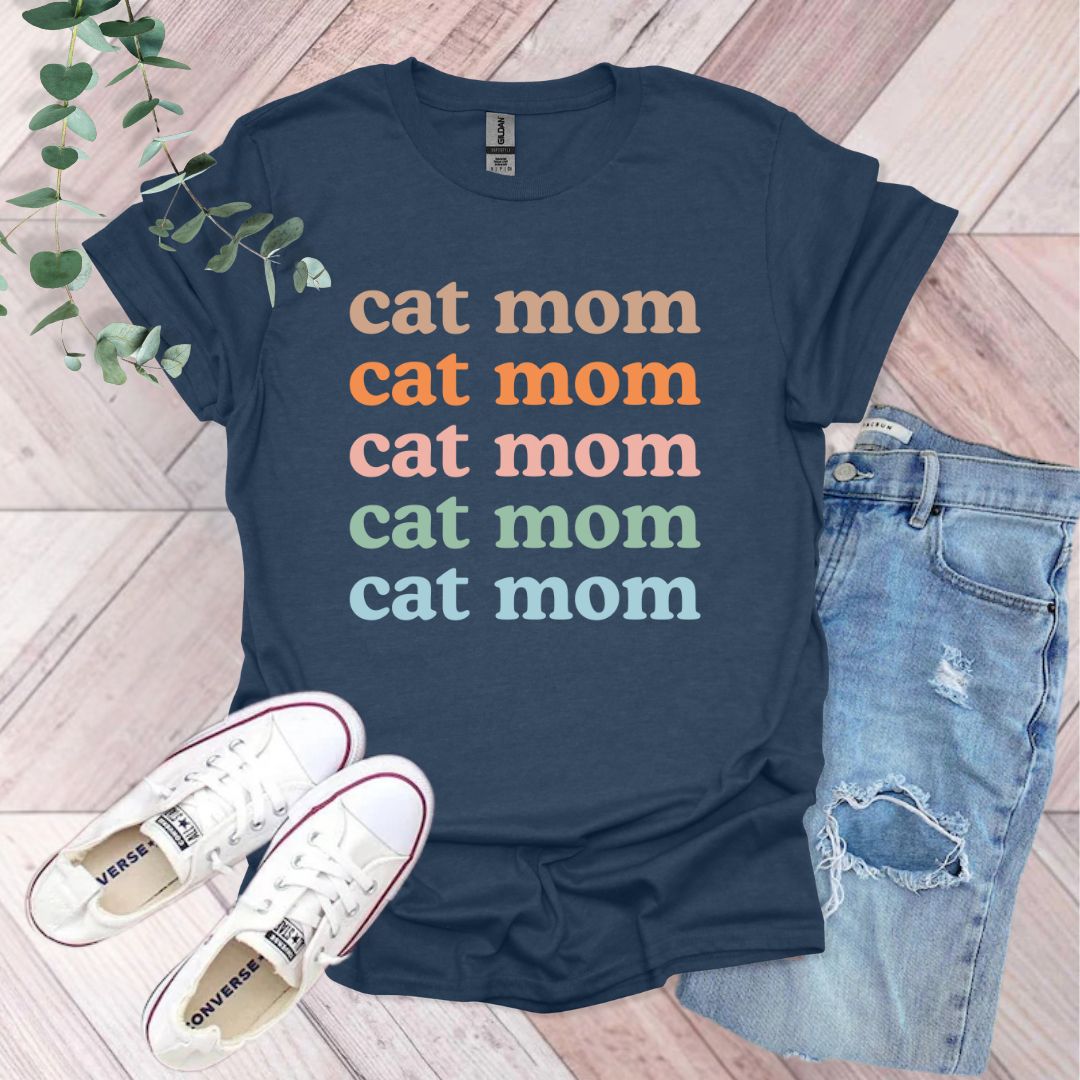 a t - shirt that says cat mom and a pair of jeans