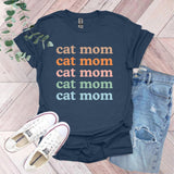 a t - shirt that says cat mom and a pair of jeans