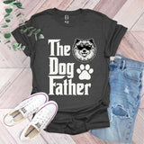 a t - shirt that says the dog father with a dog's paw on