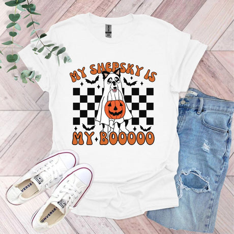 a white t - shirt with a pumpkin on it